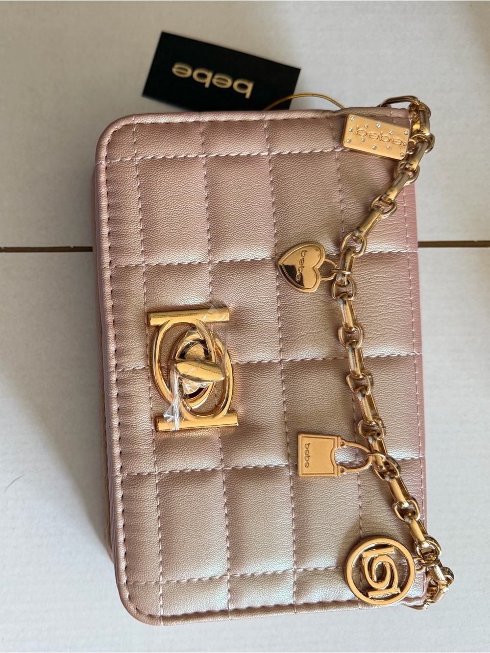 bebe Quilted Metallic Rose Gold Crossbody with Gold Charm Chain